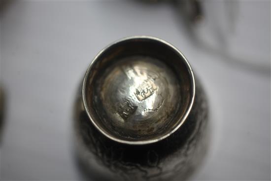 Four assorted late 18th century Russian silver vodka tots, largest 45mm.